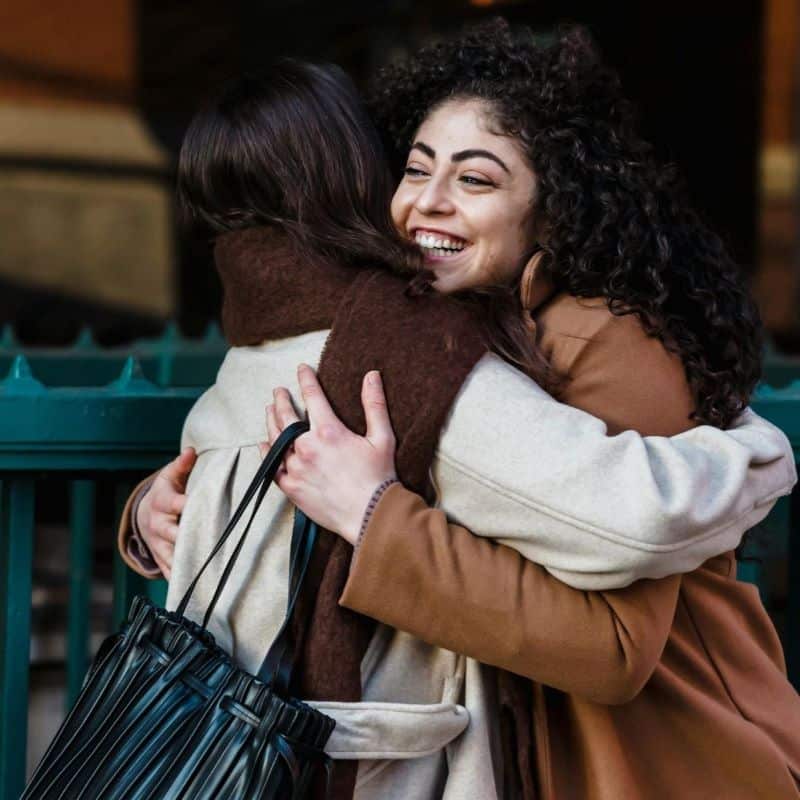 Girl Hug a hug between girls on the street